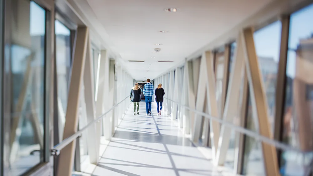 People walking in a hospital corridor