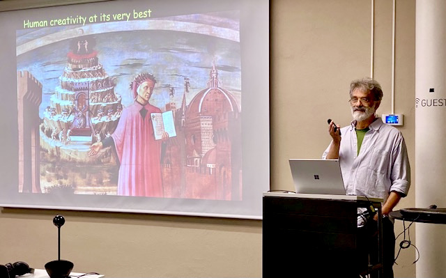 photo of Alessandro Treves standing at the podium during his presentation