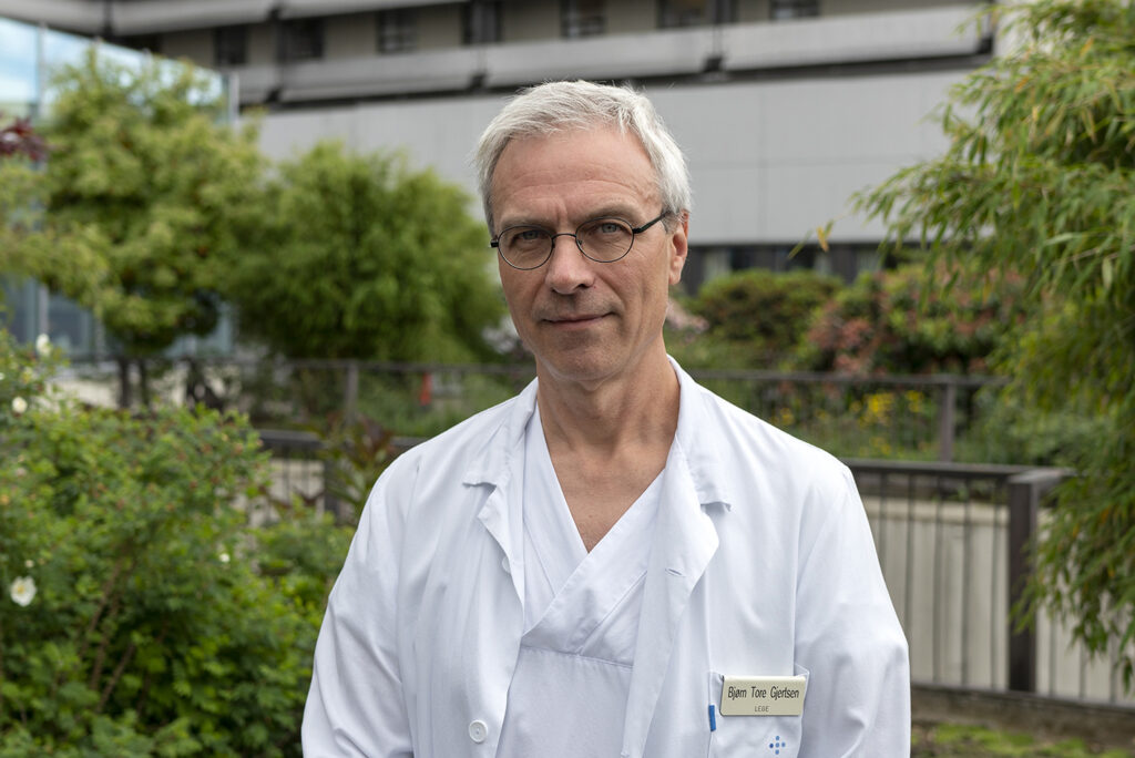 Photo of Bjorn wearing white lab coat