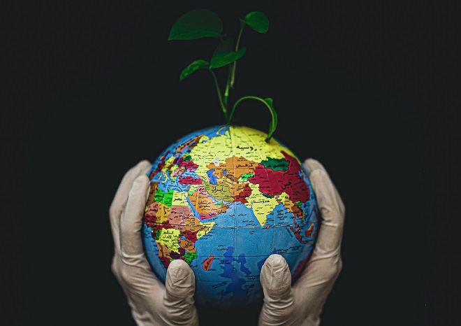 Globe, fingers, save the planet
